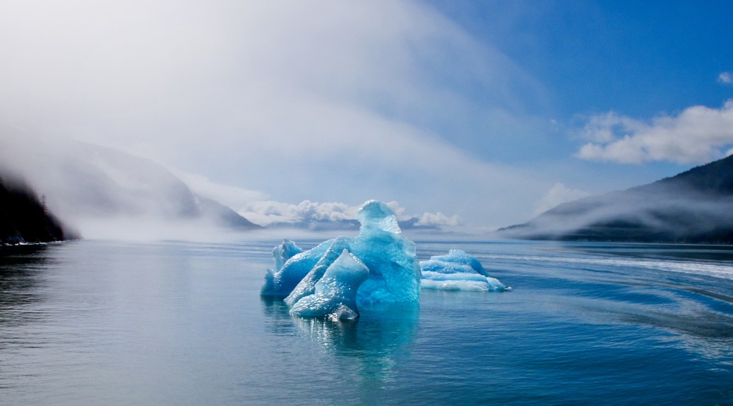 August 2015 was unusually warm in southeastern Alaska. The typically-gray skies were sunny and blue, and rare light shown through the clouds and ice.